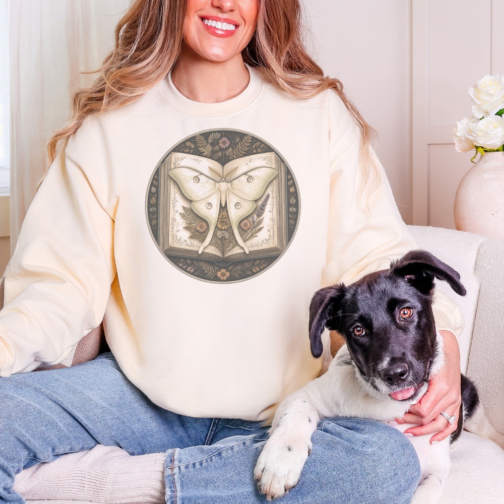 Luna Moth Resting on the Grimoire Botanical Badge Sweatshirt